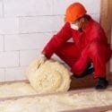 workman rolling insulation