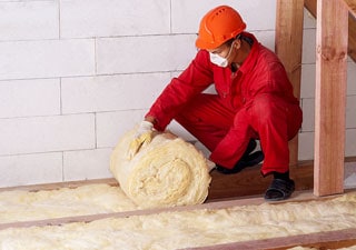 workman rolling insulation