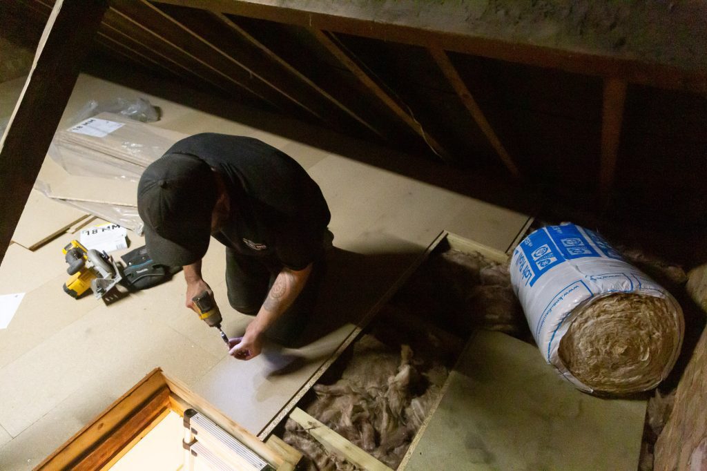 Here's one of our fitters installing loft floor boards